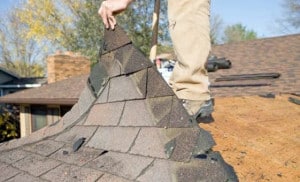 asphalt shingle roof being removed
