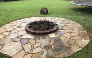 Stone and Block Backyard Firepit with Texas Shape Stone