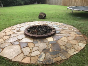 Stone Custom Fire Pit in Backyard