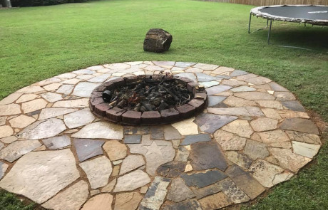 Stone Custom Fire Pit in Backyard