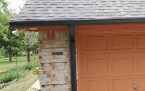 Bronze Color Rain Gutters on House with Leaf Guard Screens