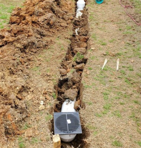 Trench in Dirt with Drainage Pipe