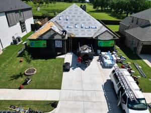 Aerial View of House Roof Replacement in Progress