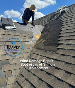 Technician on Roof Repairing Wind Damaged Shingles